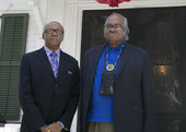 Reverend Henry Steele and John Due on the steps of the Knott House Museum during the Emancipation Day Celebration.
