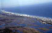 Aerial view showing a section of Atlantic Ocean shoreline at New Smyrna Beach - Volusia County, Florida