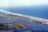 Aerial view showing a section of Atlantic Ocean coastline at New Smyrna Beach - Volusia County, Florida