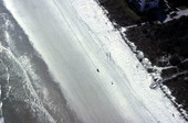 Aerial view showing a section of beach by the Atlantic Ocean between Cocoa Beach and New Smyrna Beach
