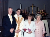 Group gathered for portrait during wedding of John Joyner and Pamela O'Hara at Saint John's Cathedral in Jacksonville, Florida.