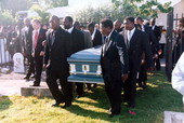 Casket for Mr. Albert Kee being carried into Key West Cemetery.