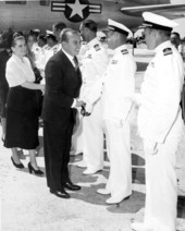 Chilean president Gabriel González Videla and Mrs. González Videla shaking hands with officers prior to flight for Washington D.C.