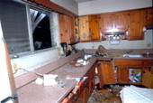 Damaged kitchen caused by small plane that crashed into the side of the house - Key West, Florida
