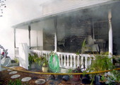 View of fire damage to the east side of the house at 1709 Flagler Ave..