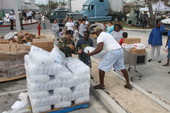 National Guard personnel distributing ice at the Key West High School to people displaced by Hurricane Wilma.