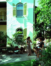Visitors being given tour of the Ernest Hemingway house museum by guide - Key West, Florida.