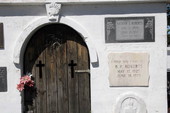 Close-up view of mausoleum with headstone tablets at the Key West Cemetery.