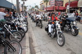Motorcycles driving down Main Street during Bike Week 2006 - Daytona Beach, Florida.