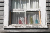 Colorful decanters in window on Love Lane - Key West, Florida