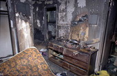 Interior view showing fire damage to upstairs bedroom at 1652 Ellsberg Ct., unit #4 in Key West, Florida.