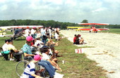 View showing spectators watching the assorted aircraft taxi past them at the EAA Fly-In at Lakeland, Florida.