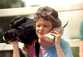 St. Petersburg Times reporter Lucy Morgan with video camera and phone.