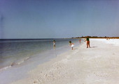 People enjoying the beach at Marco Island in Collier County, Florida.