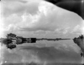 View of flooded house next to canal - Everglades, Florida.