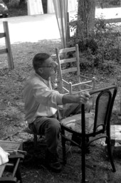 Ned Johnson caning a chair at the 1995 Florida Folk Festival- White Springs, Florida