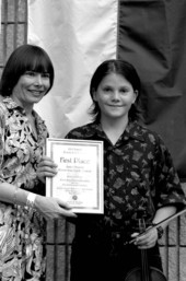 Florida Secretary of State Sandra B. Mortham presenting Martin Johnson with first place in the old time fiddling contest at the Florida Folk Festival- White Springs, Florida