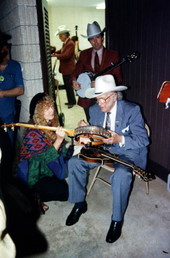 Bill Monroe signs Liz Pennock's banjo - White Springs, Florida .