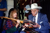 Bill Monroe signs Liz Pennock's banjo - White Springs, Florida .