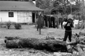 Alfonso Jennings with pieces of firewood- Lamont, Florida