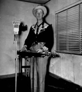 Arnold "Red" Brim with his "lap-steel" or "biscuit board" slide guitar- Live Oak, Florida