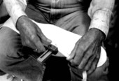 Whip maker Curly Dekle measuring to make a whip handle- Macclenny, Florida
