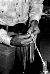 Whip maker Curly Dekle braiding a whip- Macclenny, Florida