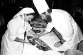 Rina and Baruch Kramer preparing salmon for a bar mitzvah - Miami Beach, Florida.