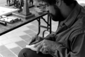 Jose Orta carving piece of wood at Historical Museum of Southern Florida during Traditions Festival - Miami, Florida.