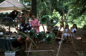 Lance Leonard sitting with his hand woven coconut palm hats at the Florida Folk Festival - White Springs, Florida