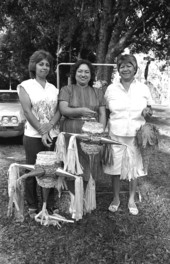Victoria Grimm, Maria Garza, and Raquel Herrera holding pinatas they made