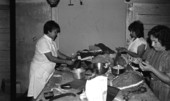 Victoria Grimm, Maria Garza, and Raquel Herrera making pinatas