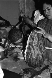 Vicki Grimm, a Mexican American woman, making a pinata