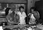 Victoria Grimm, Maria Garza, and Raquel Herrera holding pinatas they made