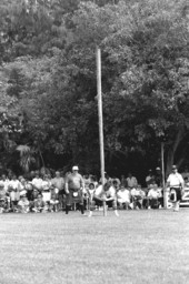 Man participating in "turning the caber" at Scottish games