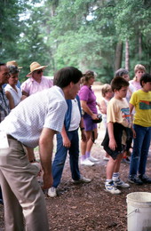 Folklorist Ormond Loomis watching children play a game at a 4th of July celebration- Hamilton County, Florida