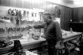 Saddlemaker Blake Kral showing off the tools in his workshop