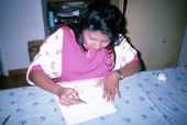 Indian woman apprentice Cecilia Campos drawing Mehandi art