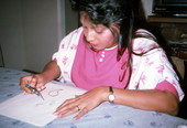 Indian woman apprentice Cecilia Campos drawing Mehendi art