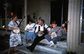 Banjo player Dale Webber practicing a tune with apprentices Linda Fackeldey, Jason Pennypacker, and Melanie Robertson- Odessa, Florida