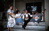 Banjo player Dale Webber practicing a tune with apprentices Linda Fackeldey, Jason Pennypacker, and Melanie Robertson- Odessa, Florida