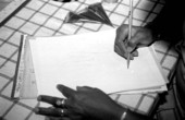 Cecilia Campos, Indian handpainting apprentice of Farzana Kalvert, sketching a hand on paper with a pencil.