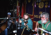 Fiddler Amy Cox performs while Gerry Cox accompanies on guitar- Miami, Florida.