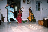 Nila Radhakrishnan (in red) teaching apprentices Prema Menon (L) and Priya Menon East Indian dance- Dade City, Florida