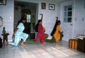 Nila Radhakrishnan (in red) teaching apprentices Prema Menon (L) and Priya Menon East Indian dance- Dade City, Florida