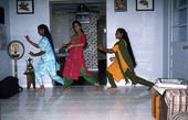 Nila Radhakrishnan (in red) teaching apprentices Prema Menon (L) and Priya Menon East Indian dance- Dade City, Florida
