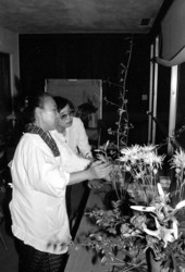 Sumino McGlamory observes as Atsuko Lefcourte makes Ikebana floral arrangement- Palm Beach, Florida.