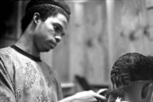 Isaac Moore getting his hair cut and styled by Teddrick Moore- White Springs, Florida