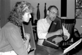 Autoharp player Charley Groth teaching apprentice Cheryl Belanger how to play the instrument- Crystal Beach, Florida