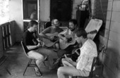Blues guitarist Tampa Blue (L) teaching apprentices Michael Dodge, Joseph Reina, and David Kirby how to play the blues- Tampa, Florida.